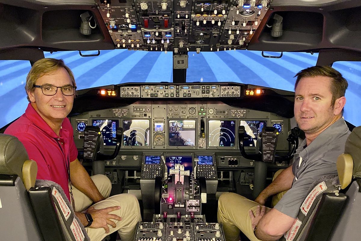 Two ATP CTP students seated in a Boeing 737 simulator flight deck at the Dallas Fort Worth satellite