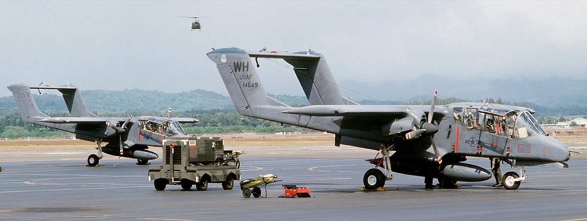 Two OV-10 Bronco aircraft parked on a military flight line